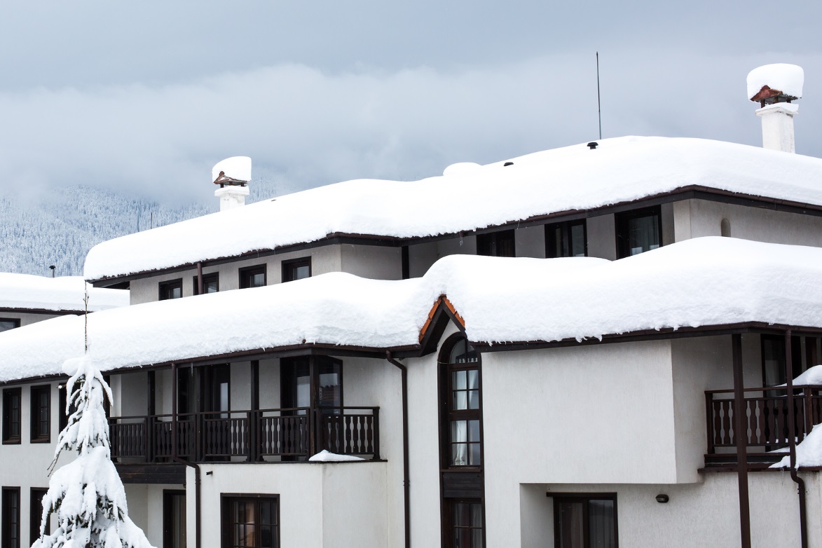 Surrey Roofing Tips: How to Manage Snowfall on a Flat Roof Efficiently